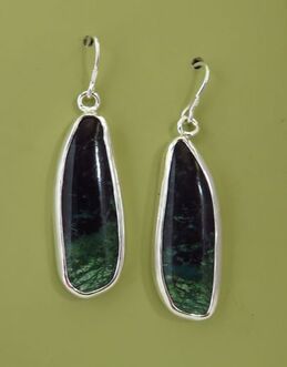 Handmade sterling silver earrings with bezel set green agate oblong cabochons on an olive-green background